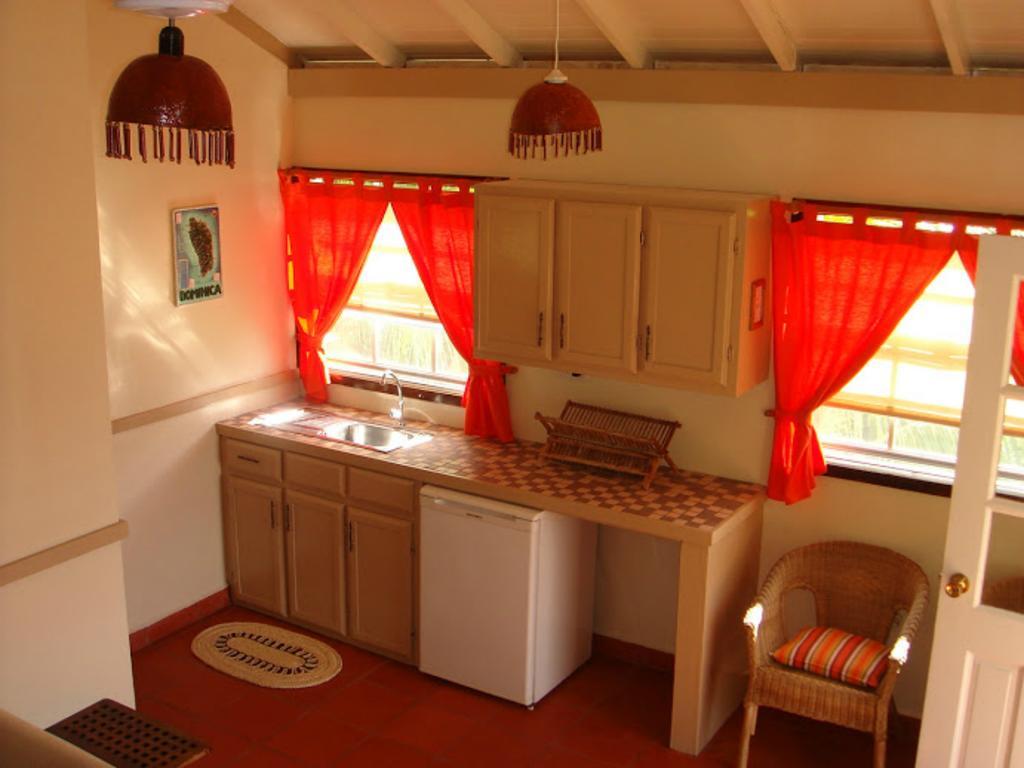Calibishie Lodges Hotel Quarto foto