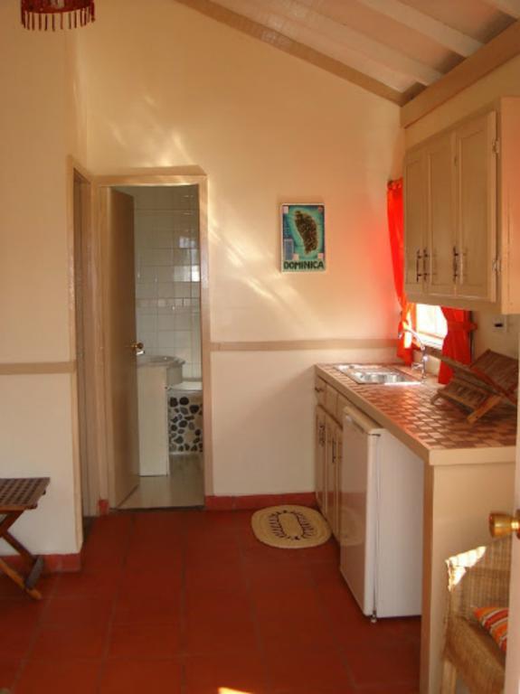 Calibishie Lodges Hotel Quarto foto